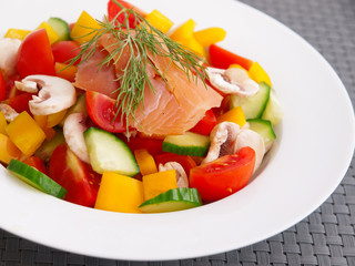 Salad from tomatoes, cucumbers, yellow peppers, mushrooms and sm