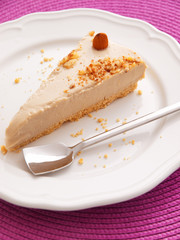 Vanilla cake with heavy cream. One piece on a white plate