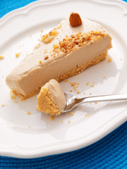 Vanilla cake with heavy cream. One piece on a white plate