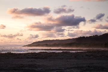 Fototapeta na wymiar Sunset on rocky beach