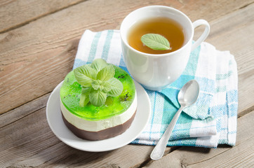 herbal tea with cake on wooden background. horizontal position