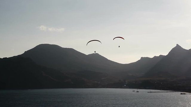 Two paraglider above the bay