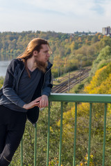 Fototapeta premium Portrait of man with a long beard and a long hair gone with the