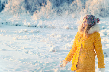 Young Woman playing with snow Outdoor Winter Lifestyle happiness emotions nature on background