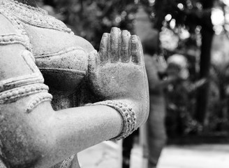 indian woman statue in namaste