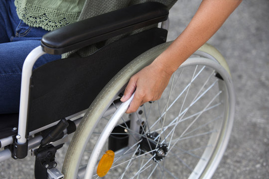 closeup of woman sitting in a wheelchair