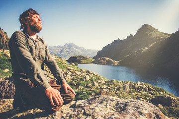 Bearded Man relaxing alone with nature Travel Lifestyle concept lake and mountains  landscape on...