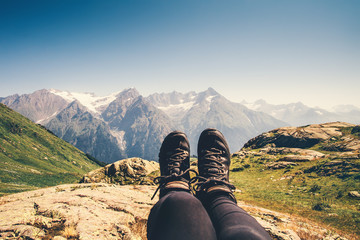 Feet trekking boots hiker selfie relaxing with mountains landscape view outdoor Travel Lifestyle...