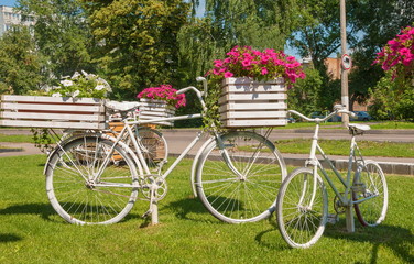 Fototapeta na wymiar Festive design of Boulevard flower beds as bicycles
