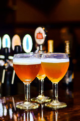 three glasses standing on the bar
