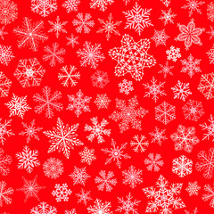Seamless pattern of snowflakes, white on red