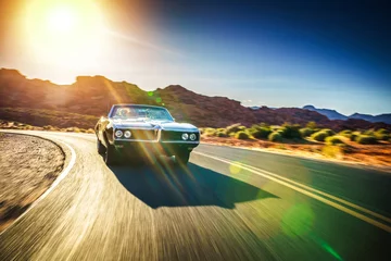 Aluminium Prints Fast cars driving fast through desert in vintage hot rod car