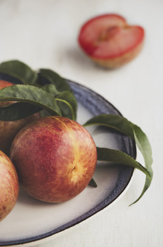Close-up of pluots on plate