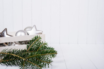 Christmas decoration over white striped background - selective focus, copy space