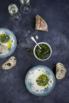 Italian Style Salsa Verde served with bread and white wine. Phot