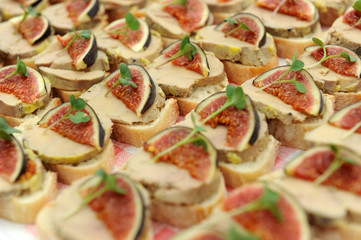 Crostini with foie gras canape and slices of fig

