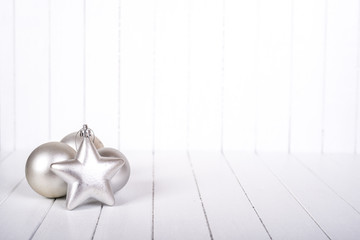 Christmas decoration over white striped background - selective focus, copy space