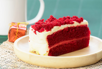 Closeup of red color Cheesecake on wood plate