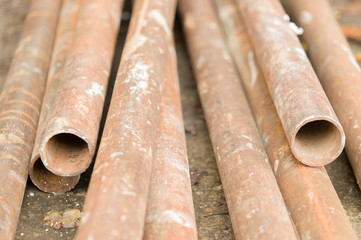 Metal pipes are stored at the factory warehouse