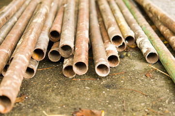 Metal pipes are stored at the factory warehouse
