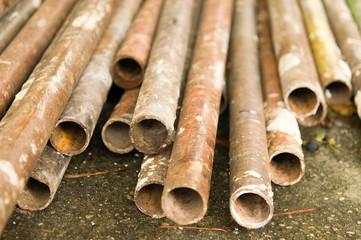 Metal pipes are stored at the factory warehouse