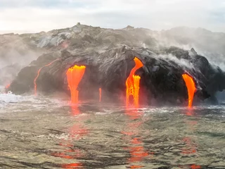  Close up of Kilauea Volcano, Hawaii Volcanoes National Park, also known Kilauea Smile because from 2016 seems to smile, erupting lava into Pacific Ocean, Big Island. Scenic sea view from the boat. © bennymarty