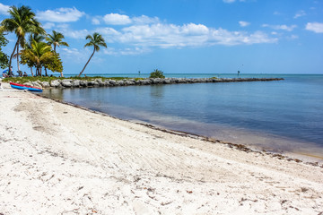 Fototapeta na wymiar Smathers Beach in Key West, Florida is the longest beach on the island and is equipped with all comforts for a relaxing tropical vacation.