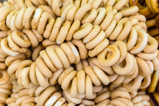 big chest small yellow bagels. Flour products.