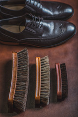 old wooden brushes with footwear