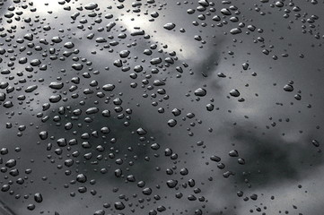 brushed metal surface with water drops