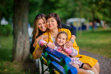 Fototapeta na wymiar girl with mother and grandmother