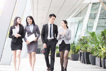 businesspeople talk in office