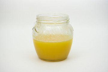 Honey bank on a white background, glass jar