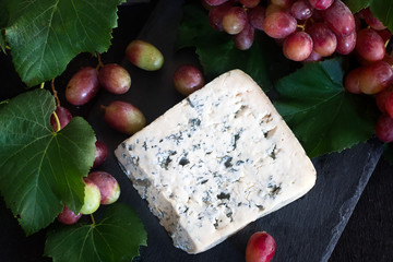 Blue cheese with grape background