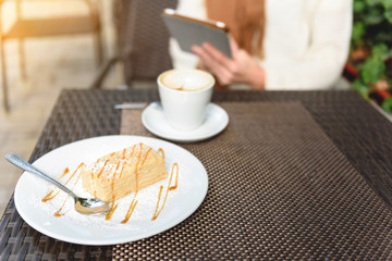 Girl having breakfast in cafe