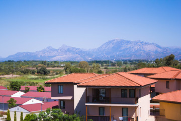 Houses on a background of mountains