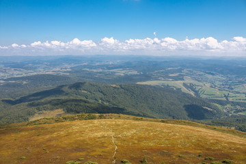 A view from the mountain top to the plains, where the horizon is well visible