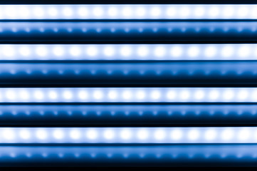 Obraz premium colour of led rigid strip lighht : four of led light line on blue