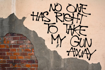 No One Has Right To Take My Gun Away - handwritten graffiti sprayed on the wall - fight against gun control and legislative restriction. Appeal to preserve right for self-defence