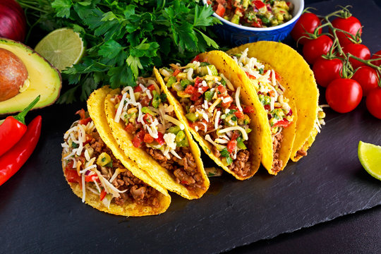 Mexican food - delicious taco shells with ground beef and home made salsa