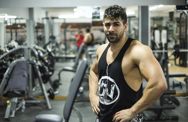 Young man posing in gym