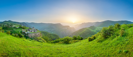 Ancient monastery in setting sun. Tatev. Armenia