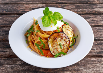 Italian Pasta with eggplants, tomato, ricotta cheese and basil