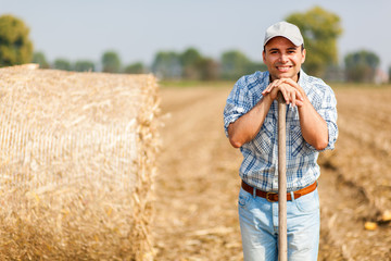     Farmer holding a pitchfork 
