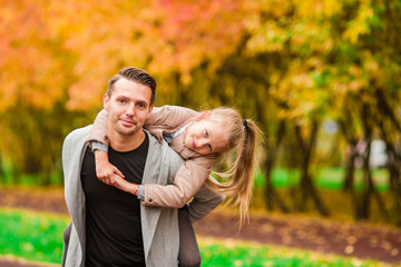 Fototapeta premium Happy family having fun on autumn day