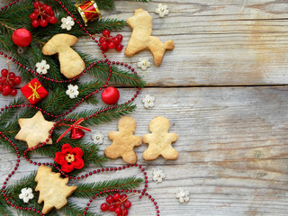 New Year and Christmas background. Greeting card with xmas ornaments, cookies, conifer branches. Winter holidays concept. Space for text.