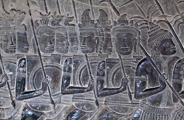 Ancient reliefs with warriors at Angkor Wat, Cambodia