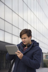 A young man with a tablet