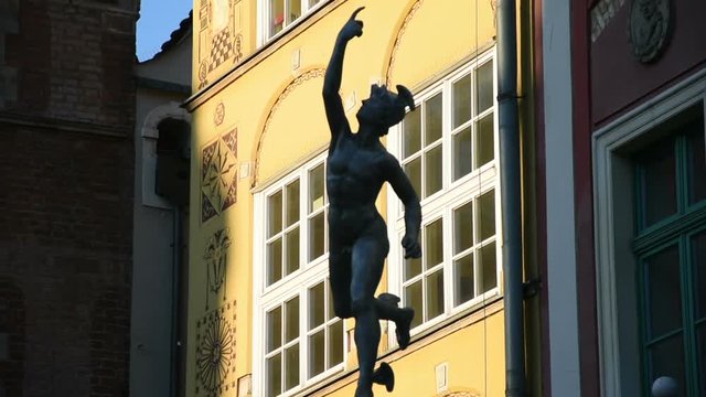 Bronze Hermes statue with doves in the old hansa town Gdansk, Poland