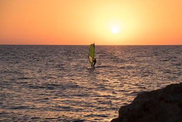 Windsurf in Mediterranean Sea at sunset. Tel-Aviv. Israel
